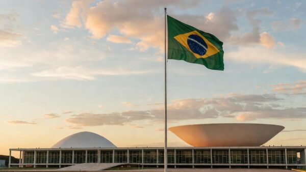 Congresso Nacional em Brasília com bandeira do Brasil ao pôr do sol